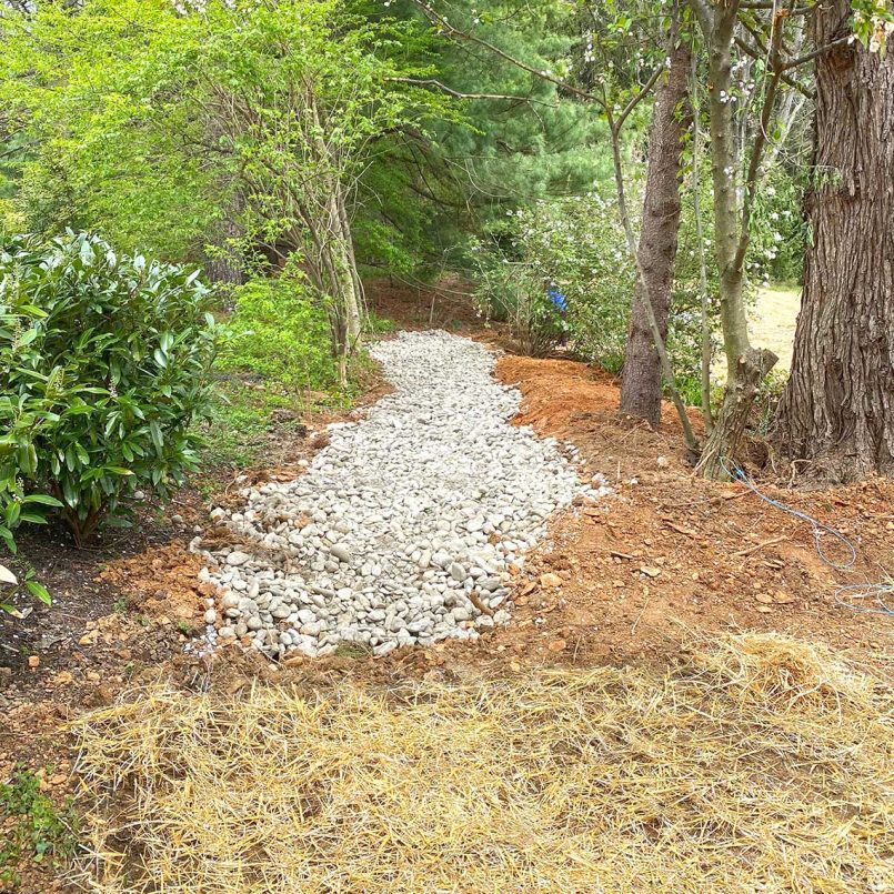 Stone drainage area allows storm water to safely be absorbed
