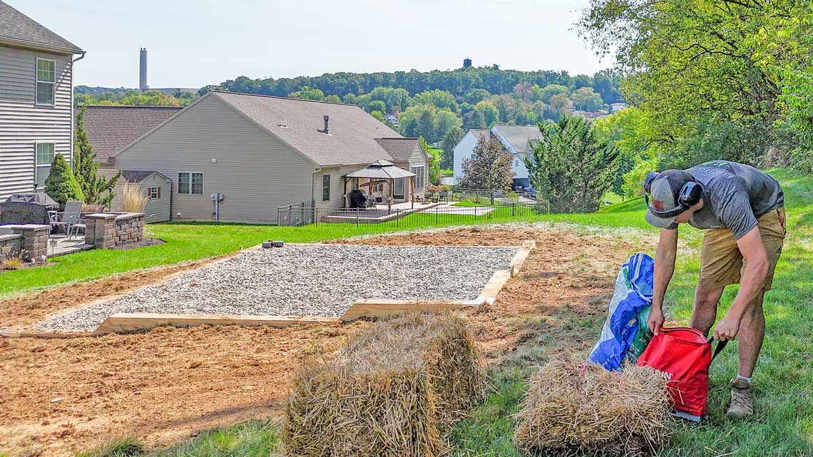 Stone base foundation with corner retaining wall