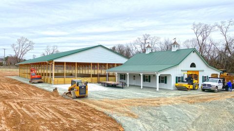 Horse arena with attached barn front view