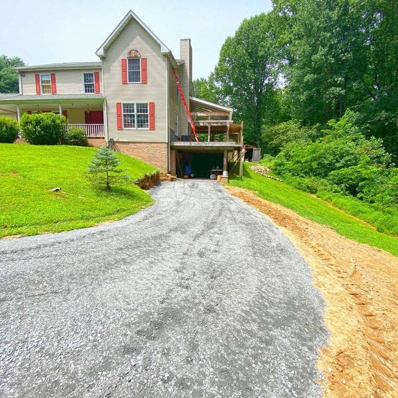 Completed gravel driveway with leveling and grading