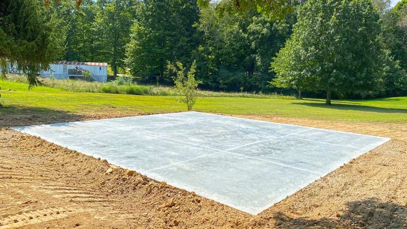 Graduated concrete pad surface