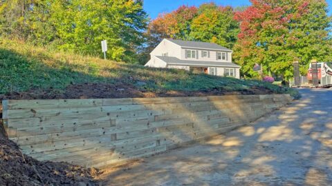 Treated lumber retaining wall