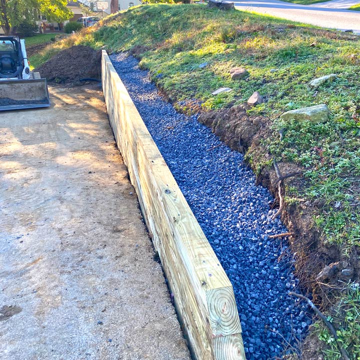 Retaining wall back fill with stone