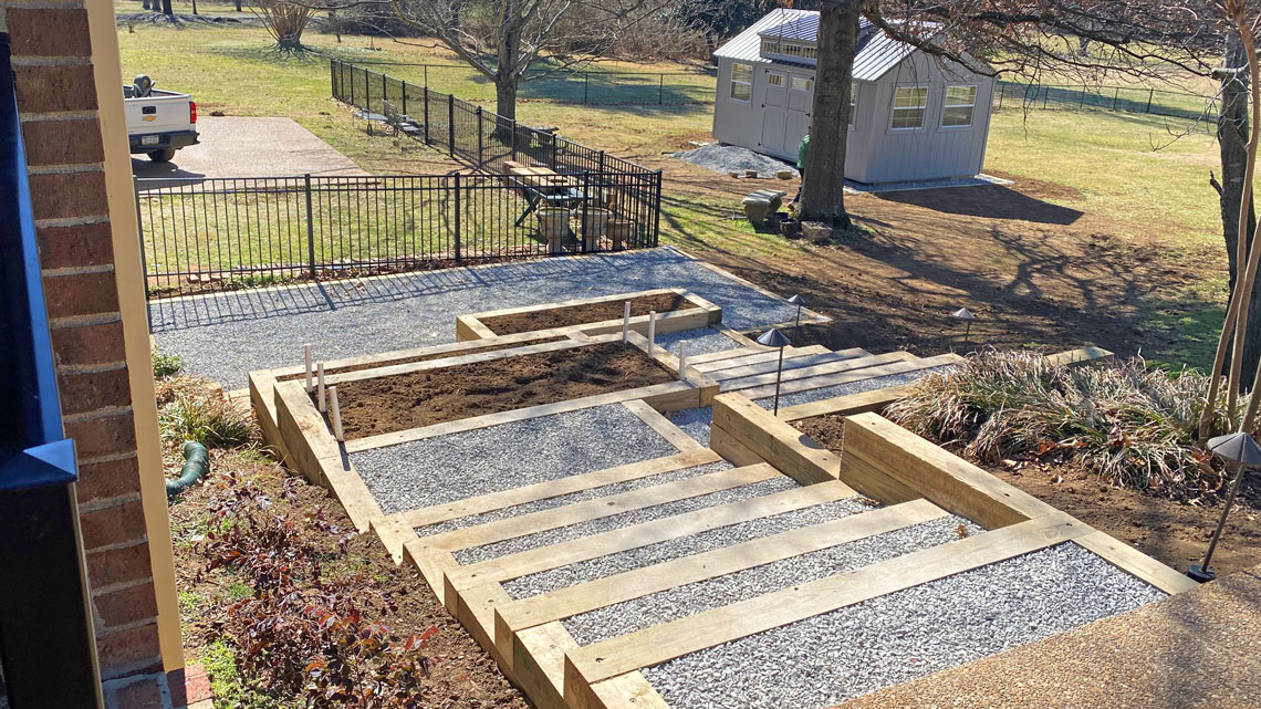 Retaining wall with stairs and garden boxes