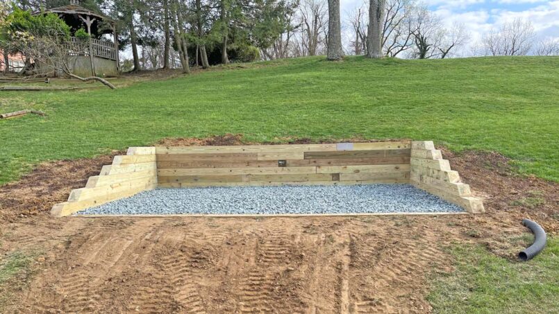 Shed pad surrounded by retaining wall