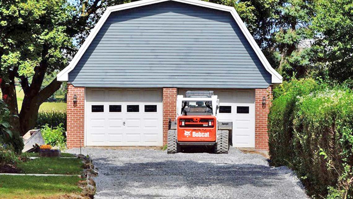 Preparing a gravel base for concrete driveway