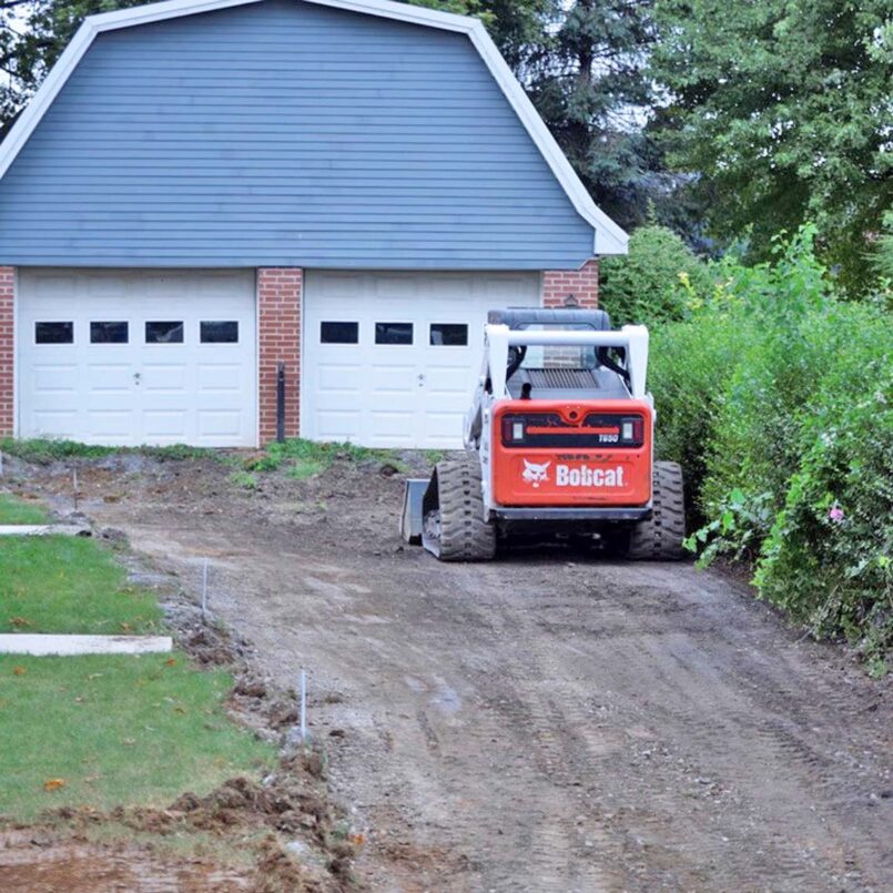 Removing some of the old driveway base