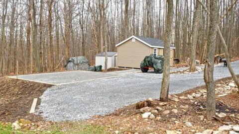 Connected stone pads with gravel driveway